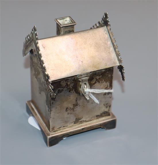 A late 19th/early 20th century Russian white metal wafer box, modelled as a dacha, height 88mm.